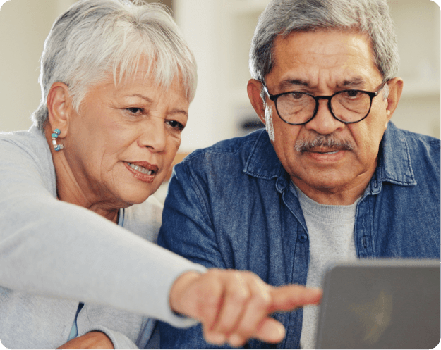 People pointing at laptop screen